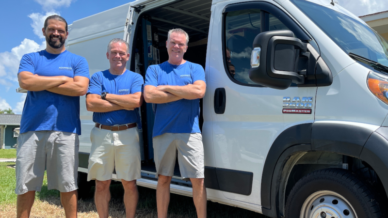 Advanced Ductless team photo in front of the company’s mini split AC work van.