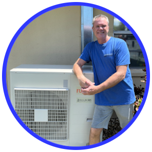 Advanced Ductless owner, Joe 'Ductless,' standing in front of an outdoor mini split AC system in Dunedin, Florida. Known for delivering expert installations and energy-efficient cooling solutions, Joe ensures top-quality service for every project.